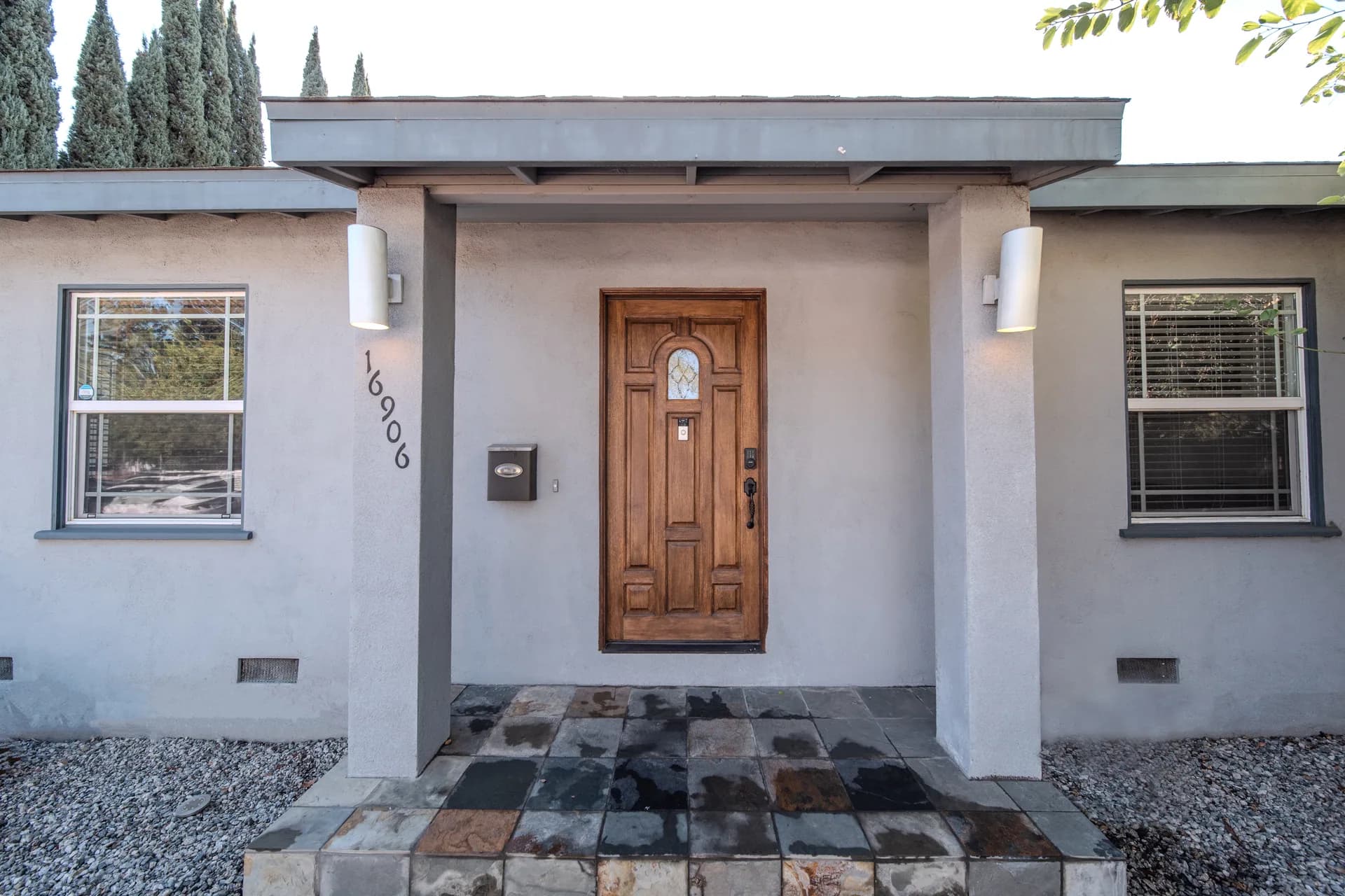 Wooden front door and covered entrance at 16906 Marlin Place